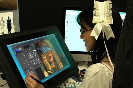 A student works on her tablet.